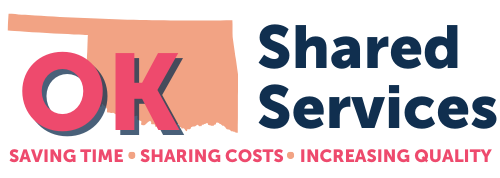 logo for oklahoma shared services featuring the letters O-K in bright pink and an outline of the state in light orange